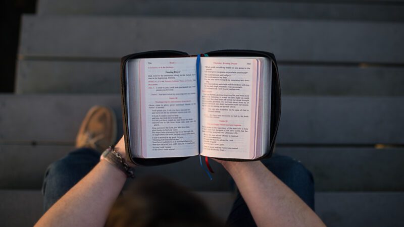 holding-open-bible Holding a Bible